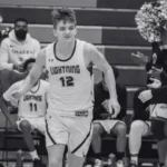 Young man runs out to the court for a basketball game.