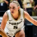 Purdue Women’s Basketball player, Taylor Feldman, dribbling a basketball during a game.