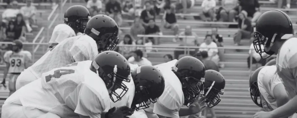 Group of students playing a high school football game.